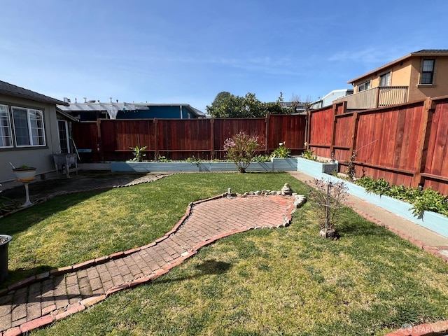 view of yard with a patio and a fenced backyard