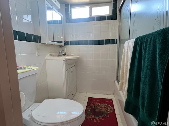 bathroom featuring tile walls, toilet, tile patterned flooring, and vanity