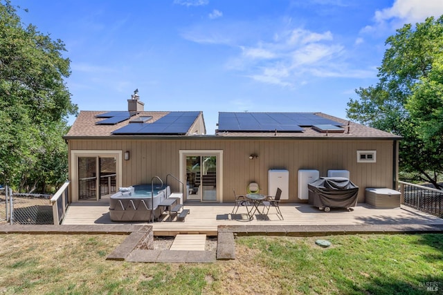 66 Bridge Rd, Novato, CA 94945 - rear view of property featuring a yard, a chimney, roof mounted solar panels, and a shingled roof