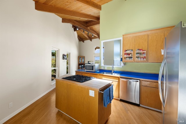 66 Bridge Rd, Novato, CA 94945 - kitchen with stainless steel appliances, a sink, wooden ceiling with exposed beams, a center island, and high vaulted ceiling