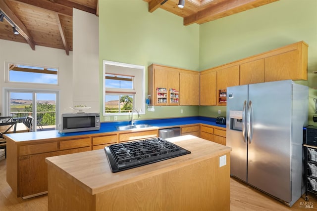 66 Bridge Rd, Novato, CA 94945 - kitchen with stainless steel appliances, wooden ceiling with exposed beams, a sink, a high ceiling, and light wood finished floors