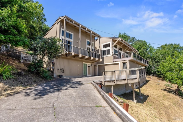 66 Bridge Rd, Novato, CA 94945 - rear view of property featuring asphalt driveway and an attached garage