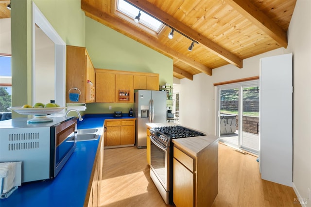 66 Bridge Rd, Novato, CA 94945 - kitchen featuring stainless steel appliances, a sink, a skylight, light wood-style flooring, and wooden ceiling with exposed beams