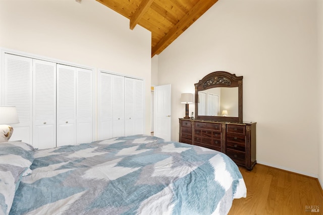 66 Bridge Rd, Novato, CA 94945 - bedroom featuring multiple closets, wood finished floors, high vaulted ceiling, wooden ceiling with exposed beams, and baseboards