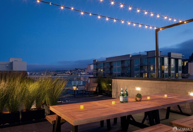 view of patio terrace at dusk