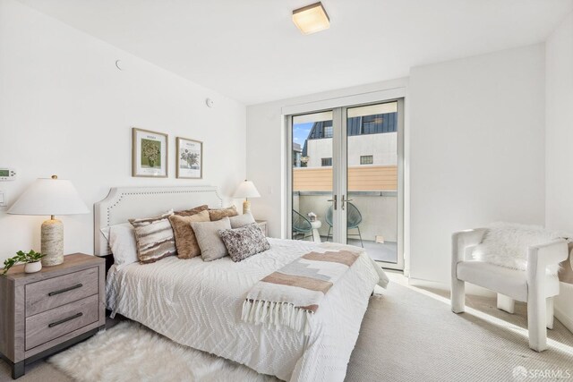 carpeted bedroom with access to outside