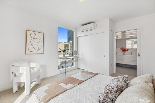 carpeted bedroom featuring a wall unit AC