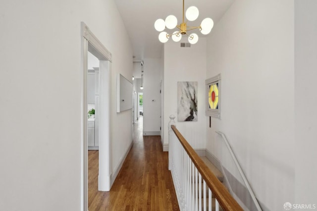 3511 23rd St Unit 1, San Francisco, CA 94110 - corridor featuring a chandelier and wood finished floors