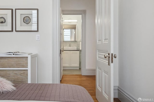 3511 23rd St Unit 1, San Francisco, CA 94110 - bedroom featuring wood finished floors and ensuite bathroom