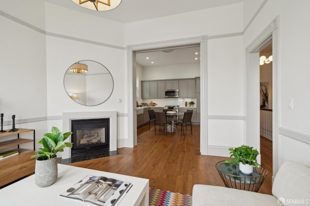 3511 23rd St Unit 1, San Francisco, CA 94110 - living area featuring a fireplace with flush hearth and dark wood-type flooring