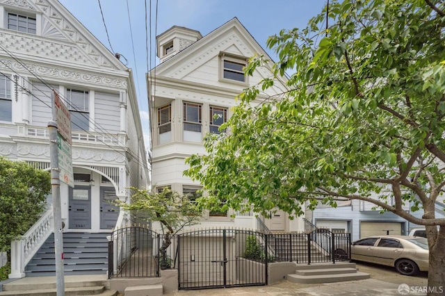 3511 23rd St Unit 1, San Francisco, CA 94110 - victorian-style house with a gate and a fenced front yard