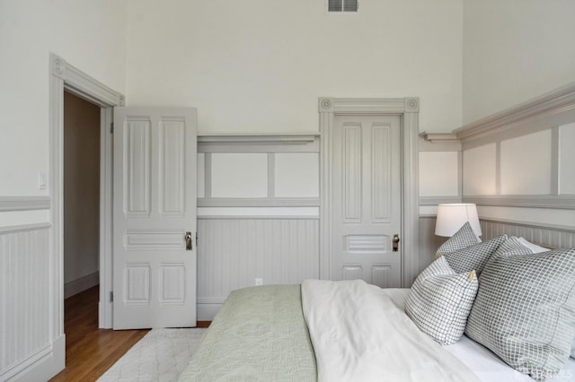 3511 23rd St Unit 1, San Francisco, CA 94110 - bedroom with a decorative wall and wood finished floors