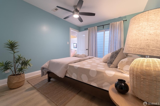 bedroom featuring wood-type flooring and ceiling fan