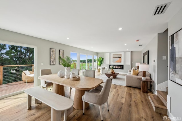 dining area featuring recessed lighting, visible vents, and light wood-type flooring
