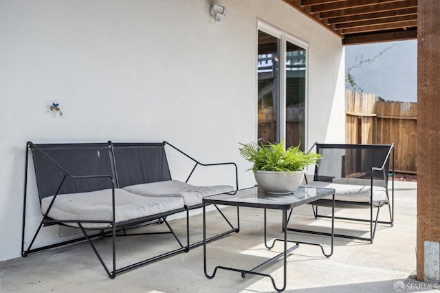 view of patio / terrace featuring fence