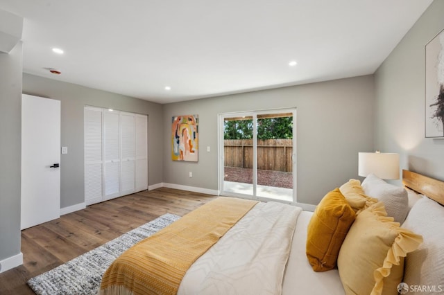 bedroom with wood finished floors, baseboards, access to outside, and recessed lighting