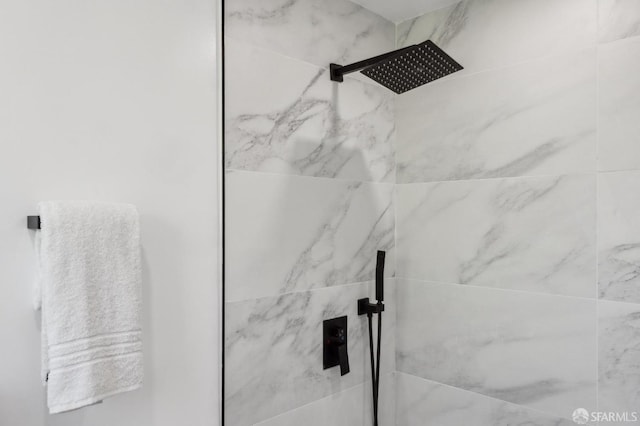 details featuring a marble finish shower