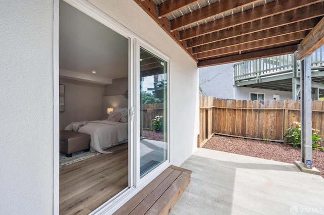 view of patio / terrace featuring fence