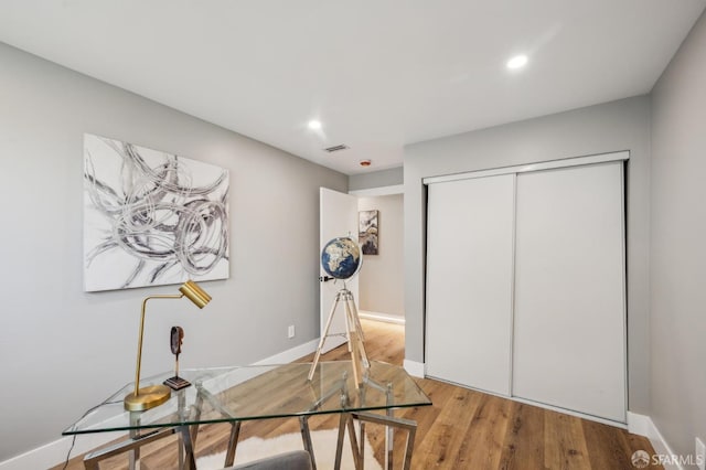 office area featuring baseboards, wood finished floors, and recessed lighting