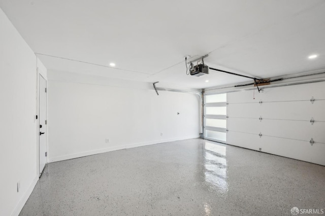 garage with baseboards, recessed lighting, and a garage door opener