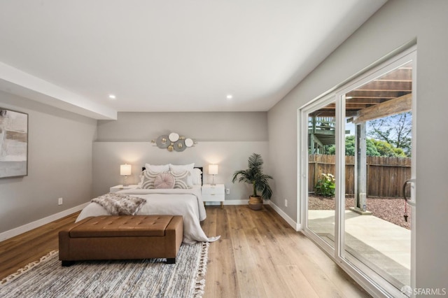 bedroom featuring recessed lighting, baseboards, access to exterior, and light wood-style floors