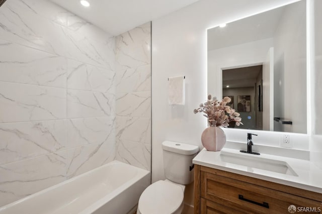 bathroom featuring shower / washtub combination, vanity, and toilet