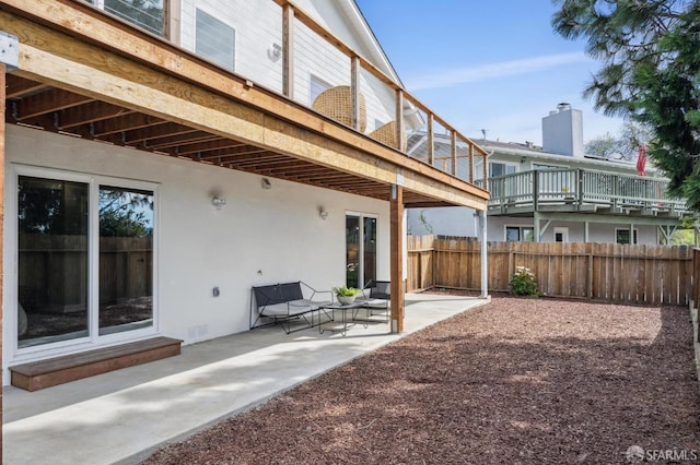 view of patio / terrace featuring fence