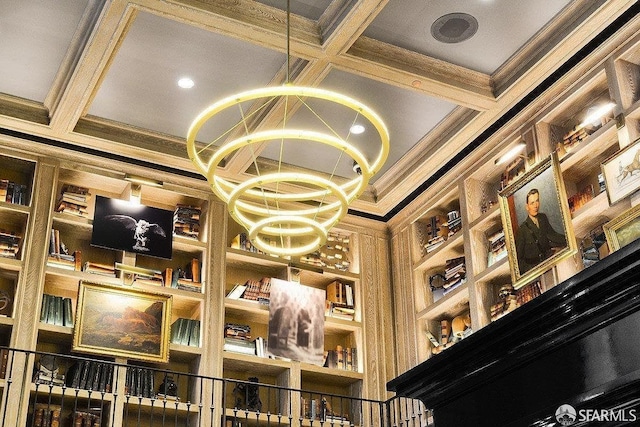 details with coffered ceiling, beamed ceiling, and ornamental molding