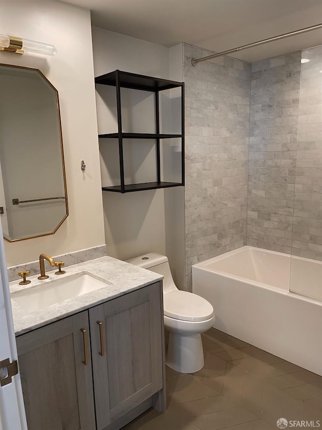 bathroom featuring toilet, tub / shower combination, and vanity