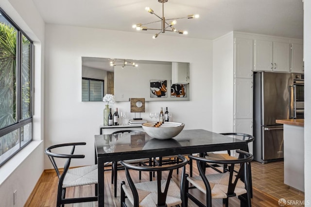 dining room featuring plenty of natural light and a chandelier