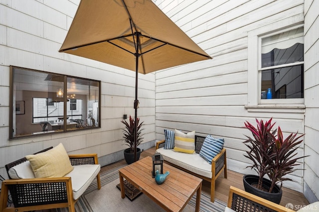 wooden terrace with outdoor lounge area