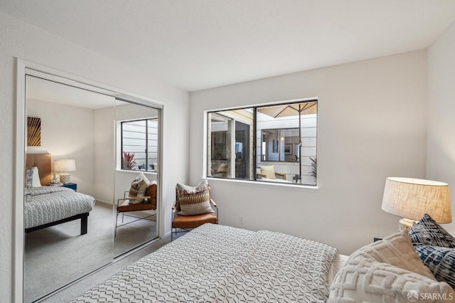 bedroom with a closet and carpet floors