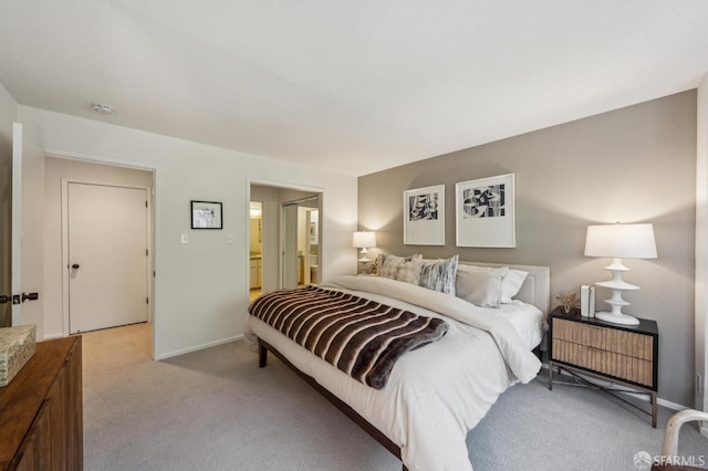 carpeted bedroom with ensuite bath