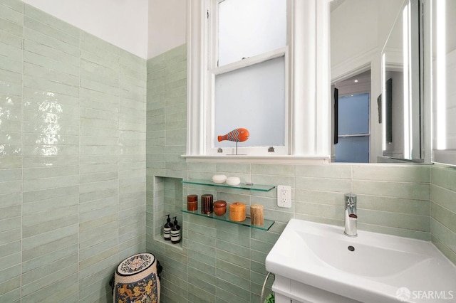 bathroom with tile walls and vanity