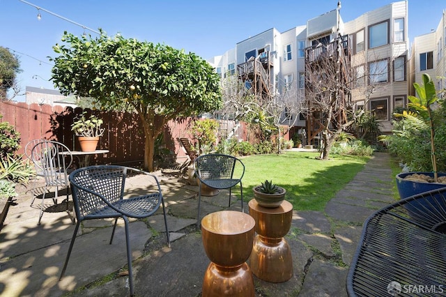 view of patio featuring fence