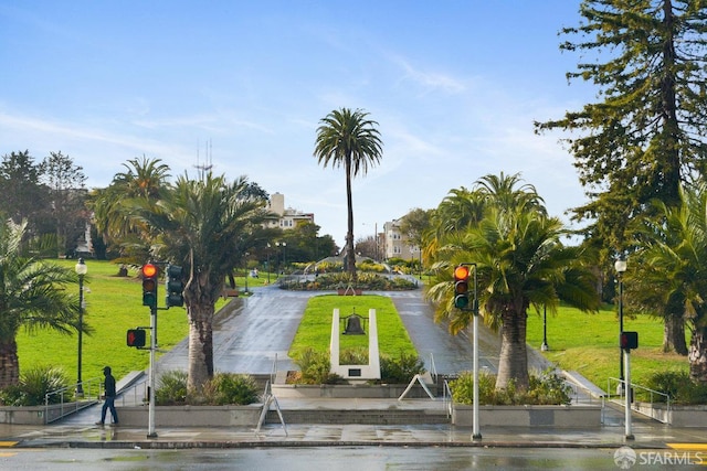 surrounding community featuring a lawn