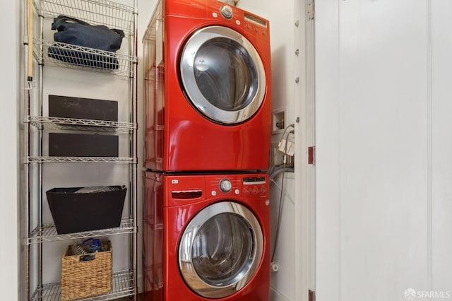 clothes washing area with laundry area and stacked washer / drying machine