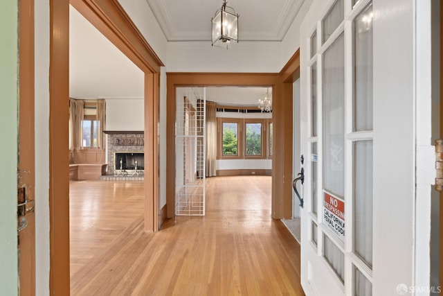 135 San Rafael Way, San Francisco, CA 94127 - entryway with a chandelier, light wood-type flooring, a fireplace, and ornamental molding
