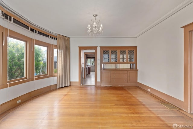 135 San Rafael Way, San Francisco, CA 94127 - unfurnished dining area featuring a chandelier, light wood-style floors, crown molding, and baseboards