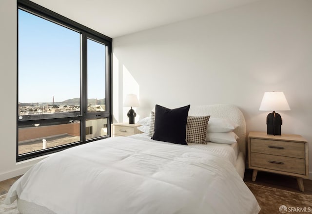 bedroom featuring a wall of windows