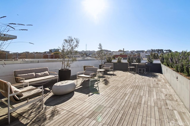 wooden deck with outdoor lounge area