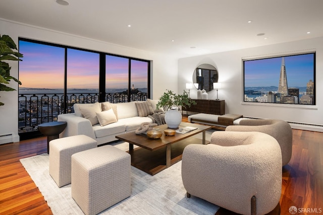 living area with light wood-style floors, a view of city, and recessed lighting