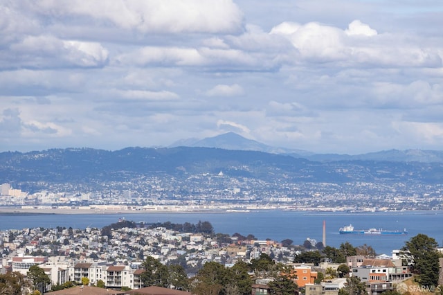 water view featuring a mountain view and a city view