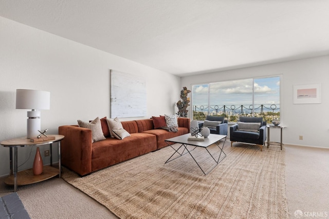 living room featuring carpet flooring and baseboards