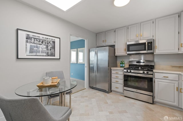 kitchen with stainless steel appliances and light countertops