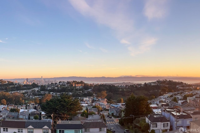 aerial view at dusk with a residential view and a mountain view