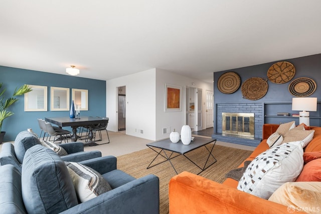 living area with a fireplace and visible vents