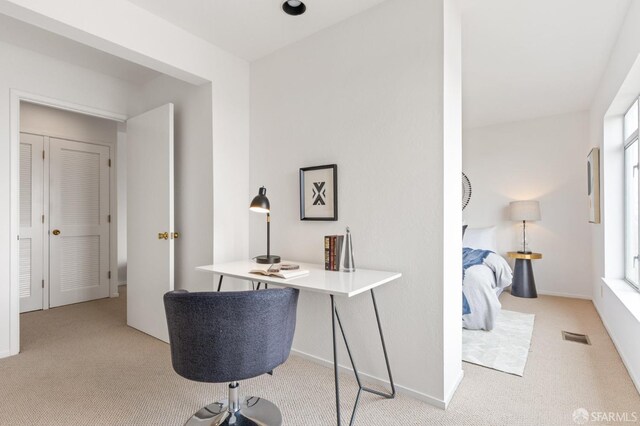 home office featuring baseboards, visible vents, and carpet