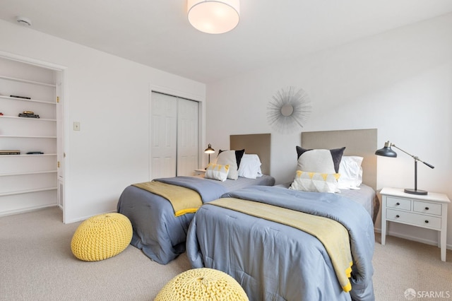 carpeted bedroom featuring a closet
