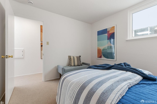 carpeted bedroom with baseboards